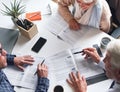 A mature couple meeting with a financial advisor to discuss retirement plans from above. A senior couple meeting a Royalty Free Stock Photo