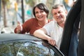 Mature couple near twizy electric