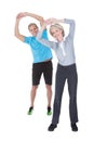 Mature couple on pilates ball Royalty Free Stock Photo