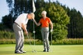 Mature couple playing Golf Royalty Free Stock Photo