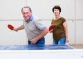 Mature couple playing ping pong Royalty Free Stock Photo