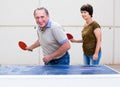 Mature couple playing ping pong Royalty Free Stock Photo