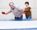 Mature couple playing ping pong Royalty Free Stock Photo