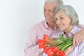 Mature couple with poppies Royalty Free Stock Photo