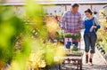 Mature Couple Pushing Trolley With Plants They Have Bought At Garden Center Royalty Free Stock Photo