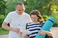 Mature couple reading paper document letter outdoor Royalty Free Stock Photo