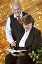 Mature Couple Reading Scripture at Christmastime Royalty Free Stock Photo