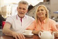 Mature couple relaxing at cafe Royalty Free Stock Photo