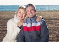 Mature couple relaxing on sea beach