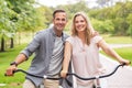 Mature couple riding bicycle