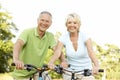 Mature couple riding bikes