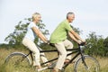 Mature couple riding tandem