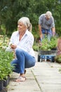 Mature Couple Shopping At Garden Centre Royalty Free Stock Photo