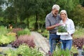 Mature Couple Shopping For Plants At Garden Center Royalty Free Stock Photo