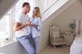 Mature Couple Standing By Bedroom Window With Hot Drink Royalty Free Stock Photo