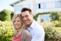 Mature couple standing in front of their new home Royalty Free Stock Photo