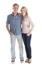 Mature Couple Standing With Hands In Pockets Royalty Free Stock Photo