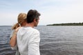 Mature couple standing by the lake admiring nature Royalty Free Stock Photo