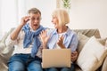 Mature couple surprised by good unbelievable news Royalty Free Stock Photo