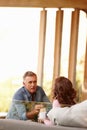 Mature couple, talking and planning in living space with coffee, bonding and discussing life and marriage in day. Older Royalty Free Stock Photo