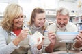 Mature Couple With Teacher In Pottery Class Royalty Free Stock Photo
