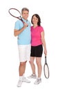 Mature couple with tennis racquets Royalty Free Stock Photo