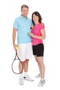 Mature couple with tennis racquets Royalty Free Stock Photo