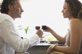 Mature Couple toasting and having lunch.