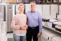 Mature couple together in home appliance store Royalty Free Stock Photo
