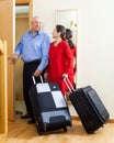 Mature couple together with suitcases Royalty Free Stock Photo