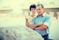 Mature couple turists examines basrelief of tomb  in historical museum Royalty Free Stock Photo