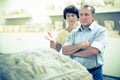 Mature couple turists examines basrelief of tomb  in historical museum Royalty Free Stock Photo