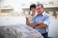 Mature couple turists examines basrelief of tomb  in historical museum Royalty Free Stock Photo