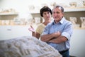Mature couple turists examines basrelief of tomb in historical Royalty Free Stock Photo