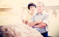 mature couple turists examines basrelief of tomb in historical museum Royalty Free Stock Photo