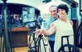 Mature couple turists examines the exhibit in museum