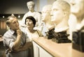 Mature couple turists examines the exhibit in museum