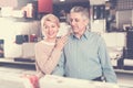 Mature couple are visiting shop of household appliances for buyi Royalty Free Stock Photo