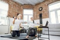 Mature couple using laptop while training with sport tools Royalty Free Stock Photo