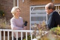 Mature cuople talking at balcon Royalty Free Stock Photo