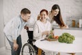 Mature disabled woman cutting vegetables in the kitchen Royalty Free Stock Photo