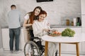 Mature disabled woman cutting vegetables in the kitchen Royalty Free Stock Photo