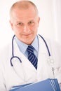 Mature doctor male portrait with folders