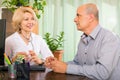 Mature doctor talking with aged male patient Royalty Free Stock Photo