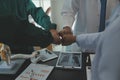 Mature doctors and young nurses stacking hands together at hospital. Close up hands of medical team stacking hands. Group of Royalty Free Stock Photo