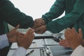 Mature doctors and young nurses stacking hands together at hospital. Close up hands of medical team stacking hands. Group of Royalty Free Stock Photo