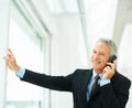 Mature employee, smile and phone call in office building talking to boss of corporate company for business. Executive Royalty Free Stock Photo