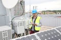 Mature engineer working on solar panels