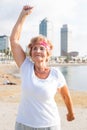 Mature woman training on beach