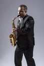 Mature Expressive Saxophone Player Posing in Suit